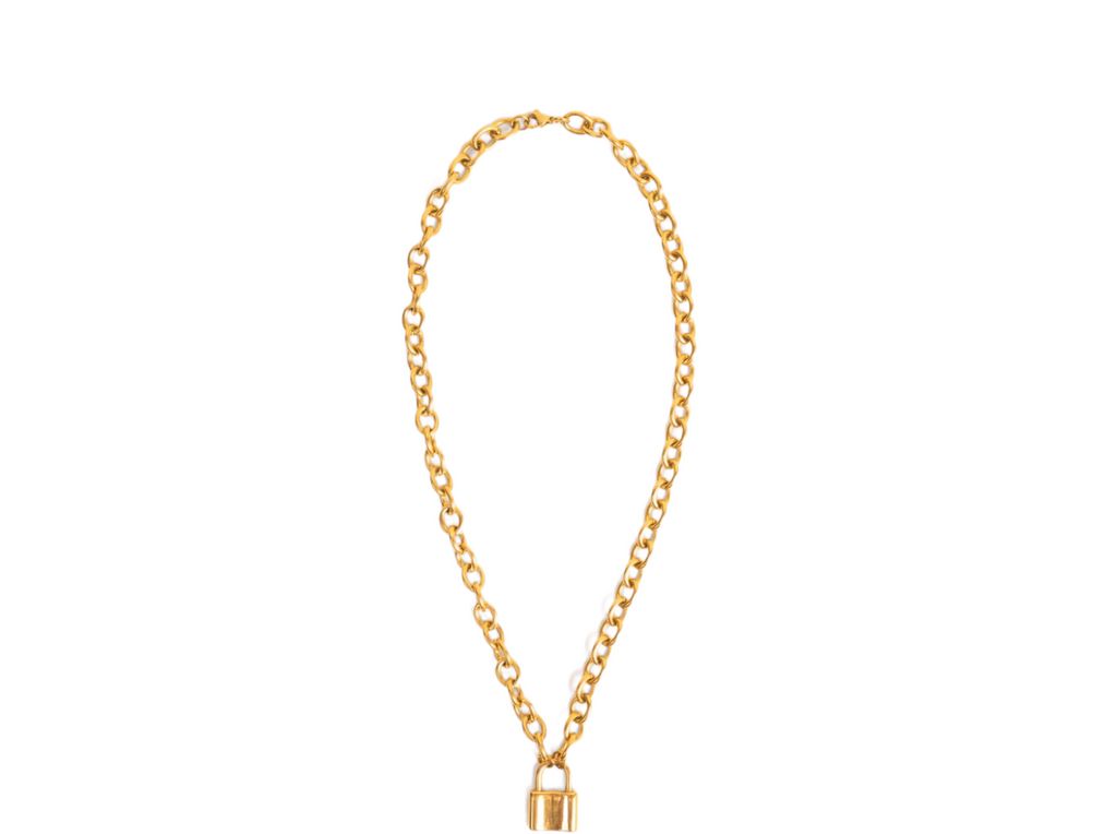 Close-up of a stylish chain lock necklace with a secure lock pendant and sleek chain.