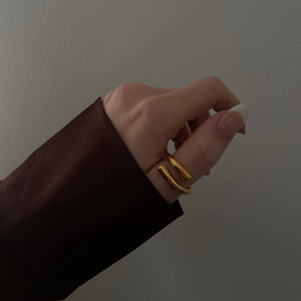 Elegant gold ring with a smooth, polished finish.