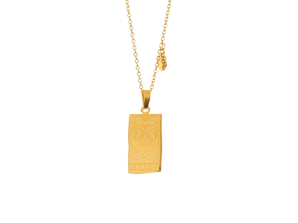 Gold pendant featuring the Aries zodiac symbol with intricate detailing.